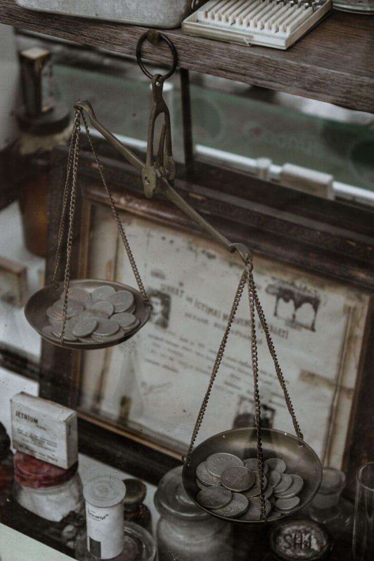 silver coins on an antique weighing scale